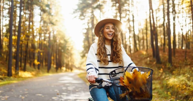 Young woman enjoying outdoor sunlight, naturally boosting her vitamin D levels