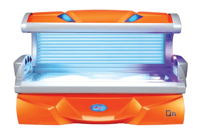An open, bright orange and silver lie-down Ultrasun Q15 tanning bed with illuminated blue UV lamps and an acrylic base.