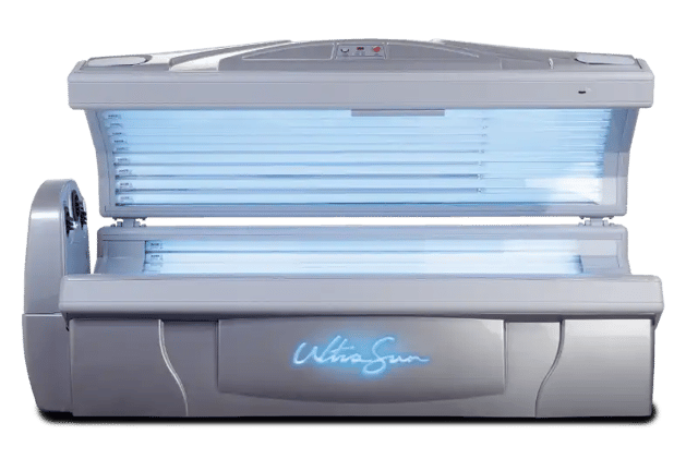 An open, silver lie-down Ultrasun Sunburst tanning bed with illuminated blue UV lamps inside and a glowing blue logo on the front base.