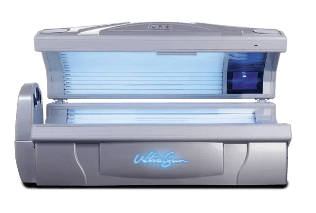 An open, bright orange and silver lie-down Ultrasun Q15 tanning bed with illuminated blue UV and facial lamps and an acrylic base.