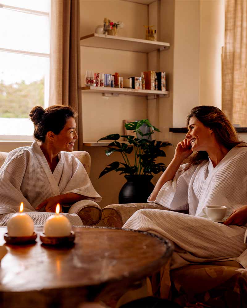 two woman talking at a wellness center