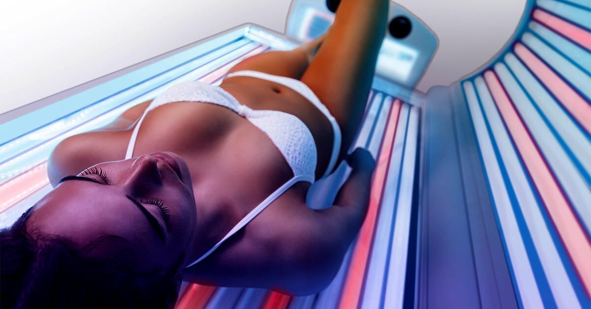 woman inside an Ultrasun Q18 hybrid tanning bed