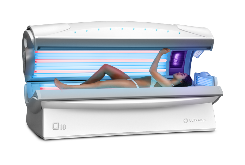 Ultrasun Q10 hybrid tanning bed in dream white metallic with model in inside