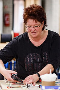 Woman assembling an Ultrasun tanning bed